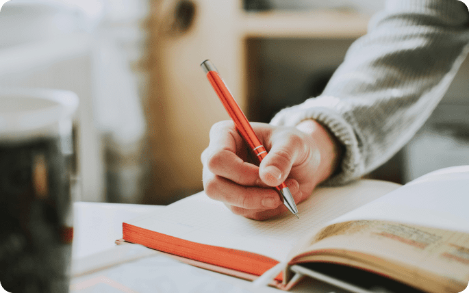 Man writing in a book